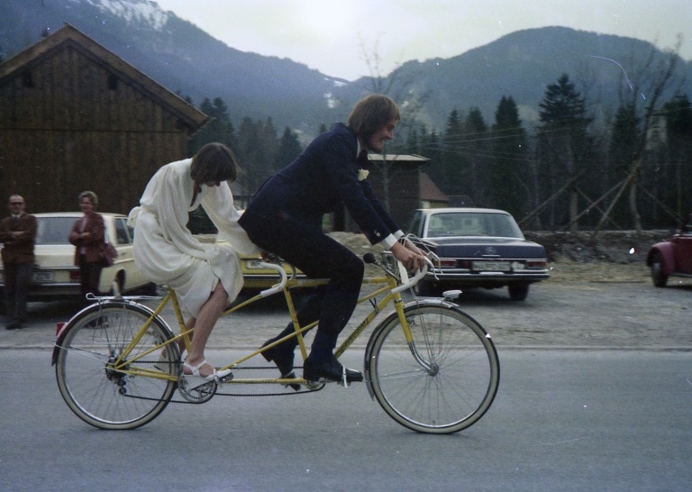 Our first tandem, being test-ridden in Oberammergau in our wedding finery, March 25 21977.